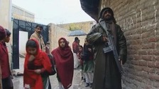 Schoolgirls in Pakistan's Swat Valley go to school under armed guard