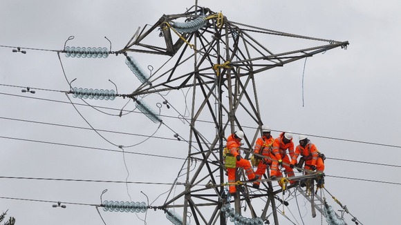 Engineers try to fix a damaged pylon in Kintyre, Scotland