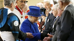 The Queen hands out Maundy money at the Christ Church Cathedral, Oxford.
