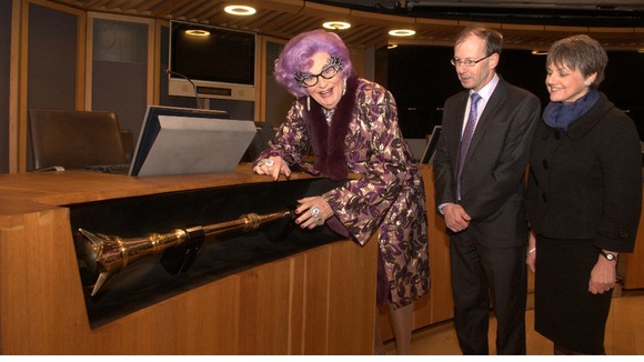 Dame Edna with the Senedd's mace