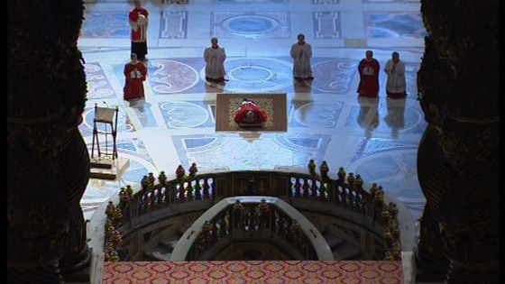 Pope Francis lies prostrate before the alter in St Peter's Basilica 