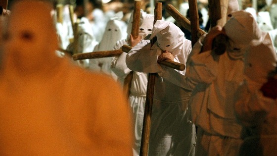 Penitents take part in a Good Friday procession in Civitavecchia, north of Rome