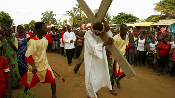 An actor portraying Jesus Christ takes part in a "Via Crucis" (Way of the Cross) at Plateau Dokui, an area of Abidjan