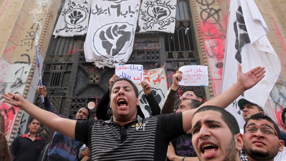 Anti-Mursi demonstrators hear the high court in Cairo this morning