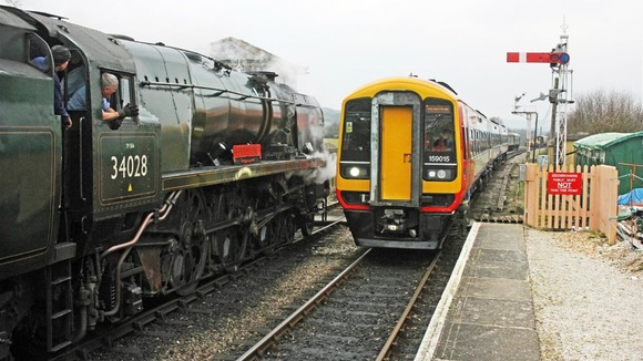 he diesel engine passes the Swanage Railway steam service