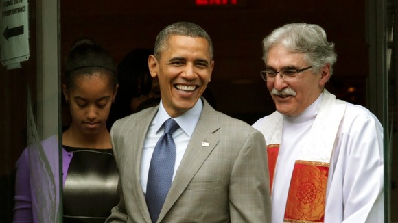 U.S. President Barack Obama and his daughter Malia walk out with Rev. Luis Leon