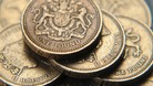 A pile of one pound coins