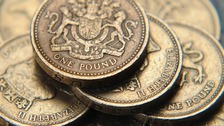 A pile of one pound coins