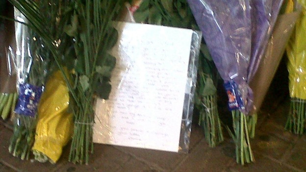 Floral tributes have been left for Ryan Harrison at Guildford Train Station.