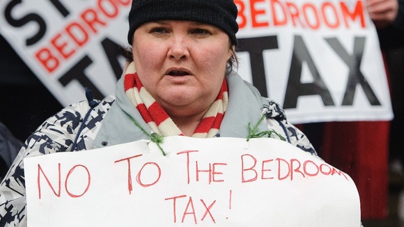 A protestor take part in a demonstration against the so-called 'Bedroom Tax'