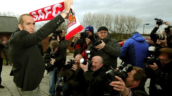 Di Canio holds a Sunderland scarf for the cameras
