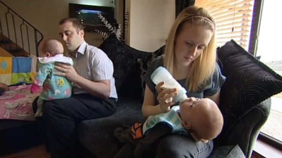 Jane and Graham Ackinclose at home with the triplets.
