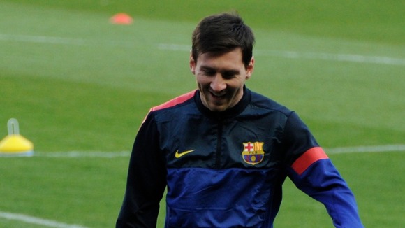 Lionel Messi cracks a smile during training ahead of Tuesday's quarter-final tie