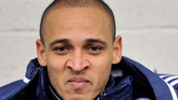 West Bromwich Albion's Peter Odemwingie sits on the bench at the Hawthorns