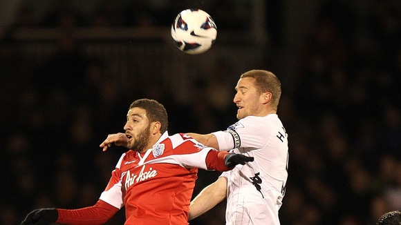 Brede Hangeland battles with Queens Park Rangers midfielder Adel Taarabt