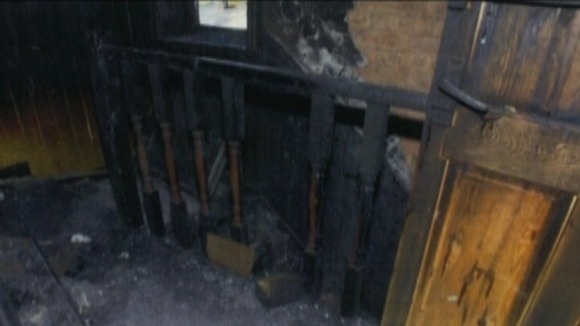 Fire damage on the upstairs landing of the Philpott home