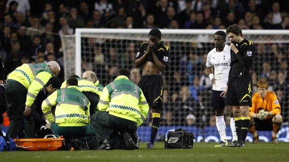 Muamba being treated by paramedics at White Hart Lane last night
