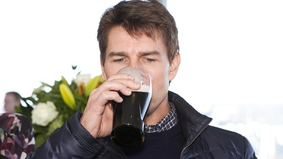 Tom Cruise enjoys a pint of Guinness