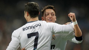 Real Madrid's Cristiano Ronaldo celebrates with Mesut Ozil during the Champions League match at the Bernabeu