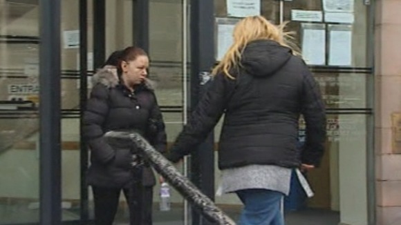 Bernadette Duffy (L) leaves the court