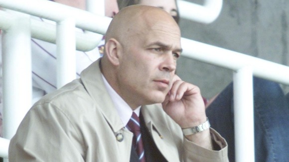 Christian Gross watches Middlesbrough v West Ham from the Upton Park stands