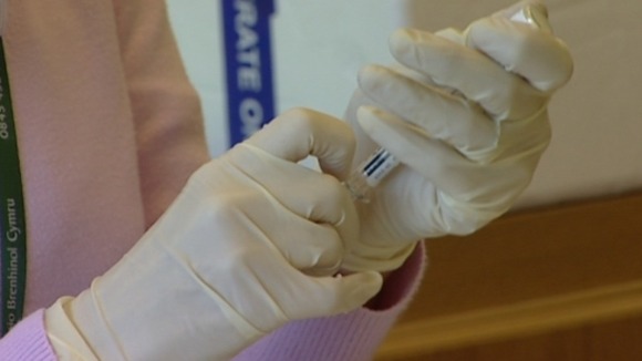 Hands holding needle