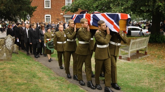 Sapper Smith's coffin is carried to his funeral