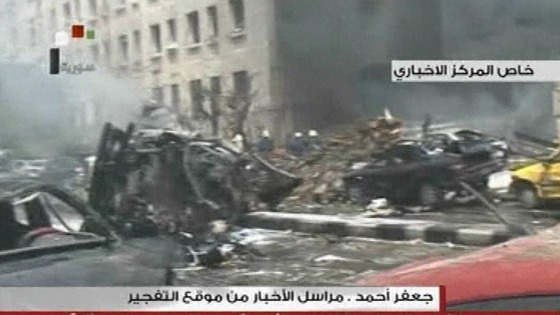 Rubble and burned out cars have been seen on local television after a huge car bomb in central Damascus 