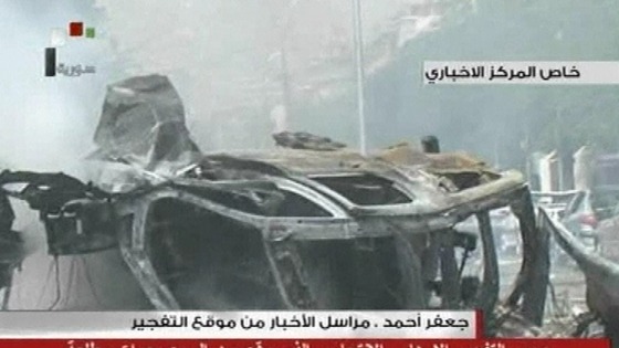 Rubble and burned out cars have been seen on local television after a huge car bomb in central Damascus 