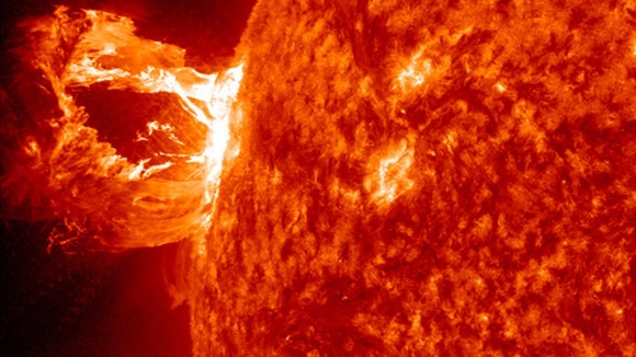 The solar flare eruption; a sudden release of magnetic energy.