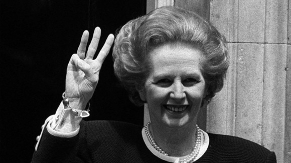 Prime Minister Margaret Thatcher giving a three-fingered salute outside 10 Downing Street as she begins her third successive term