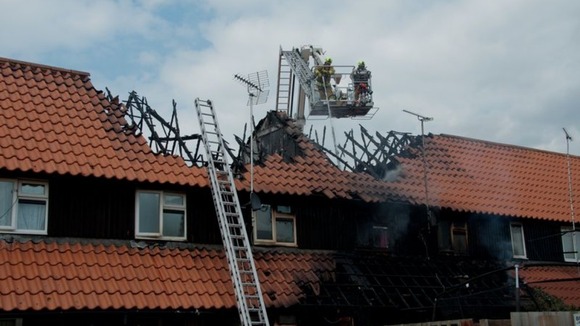 Firefighters tackle the fire.