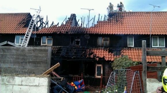 Firefighters tackle the fire.