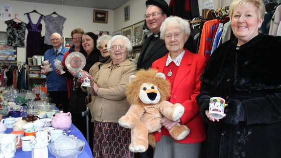 Volunteers in shop