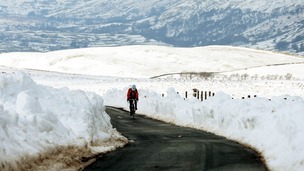 A cyclist braves the snow near Reeth in the Yorkshire Dales in March 2013