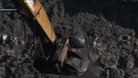 Coal being lifted out of mine by a digger