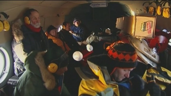 Scientists and me huddled together in the helicopter en route to the North Pole