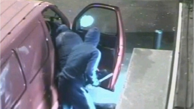 The gang with a weapon as they make their getaway after the mobile phone shop raid in Coventry