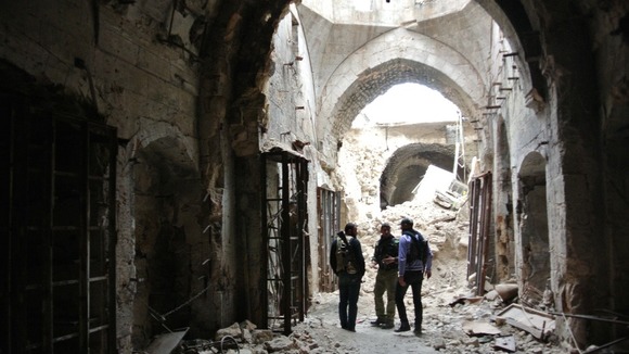 Free Syrian Army members patrolling inside the Great Mosque in Aleppo.