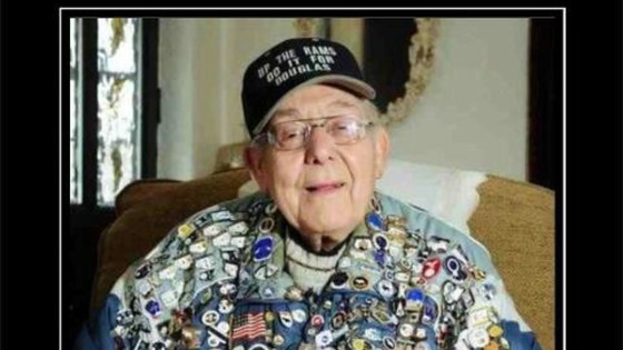Douglas Else proudly wearing his badge collection