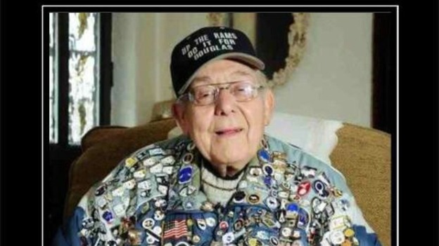 Douglas Else proudly wearing his badge collection