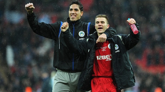 Wigan players Joel Robles and Callum McManaman celebrate the win