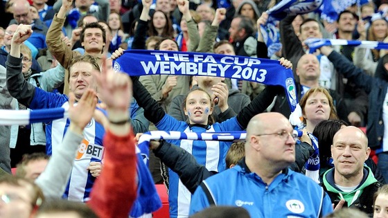 Wigan fans failed to sell their full allocation of tickets, but no one seemed to care at full-time 