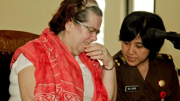 Lindsay June Sandiford talks to an translator during her first trial in Denpasar Court, Denpasar, Bali.