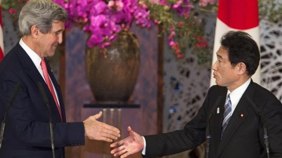 US Secretary of State John Kerry shakes hands with Japan's Foreign Minister Fumio Kishida in Tokyo today.