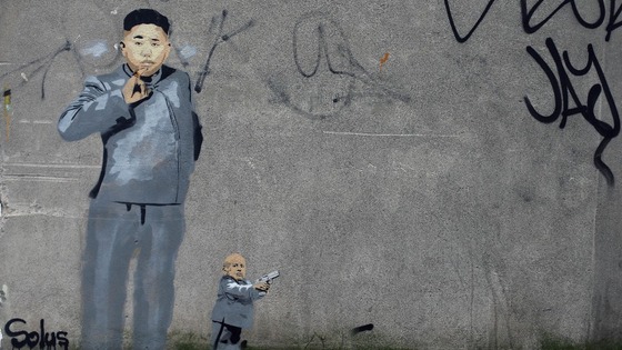 North Korean leader Kim Jong-un is given an 'Austin Powers' makeover by Dublin graffiti artist Solus.