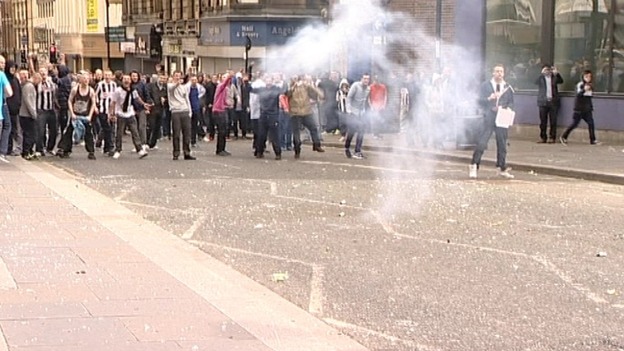 Bottles and firecrackers were thrown at police.