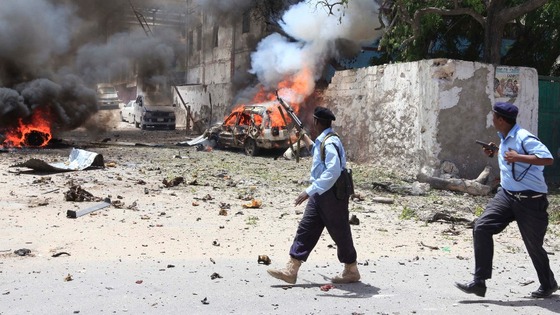 Somali policemen take up position near the scene of a deadly blast in Mogadishu.