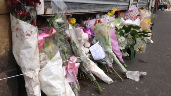 Customers and friends leave flowers paying tribute to Cockburn family.