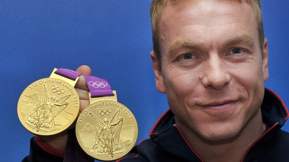 Sir Chris Hoy with two of his Olympic gold medals